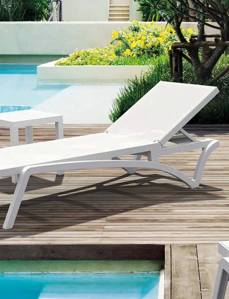 Commercial outdoor lounger positioned on a hotel deck or poolside area.