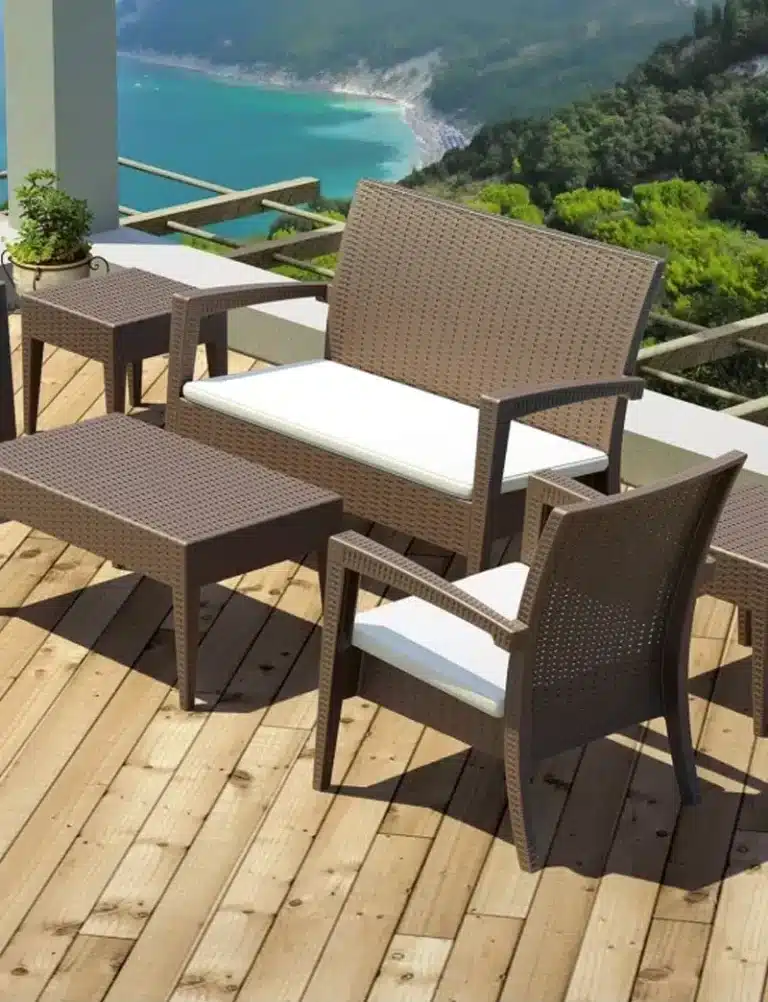 Outdoor commercial sofa set with weather-resistant cushions in a lounge or bar terrace.