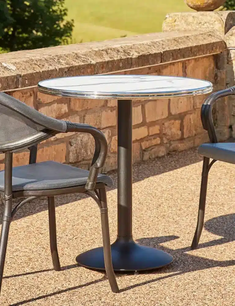 Weather-resistant outdoor table tops installed in a commercial dining terrace.