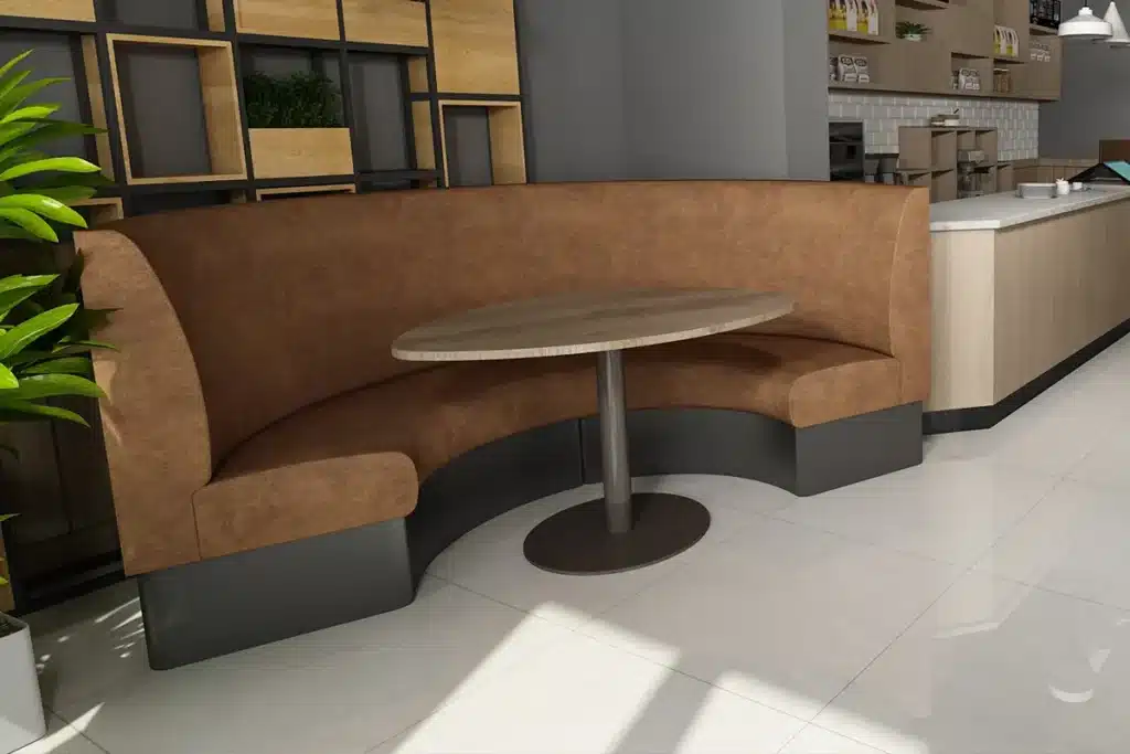 Curved half-round booth seating in a modern clubhouse, with distressed faux leather upholstery and an oak dining table.