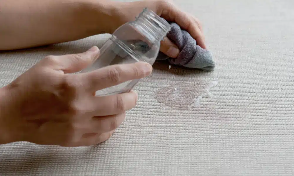 A piece of fabric being treated with crib 5 prevention solution