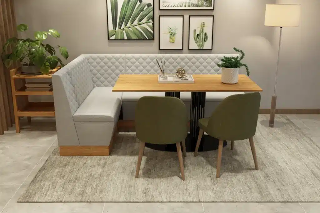 Haven quilted back corner booth seating installed in a modern dining room with table and accessories.