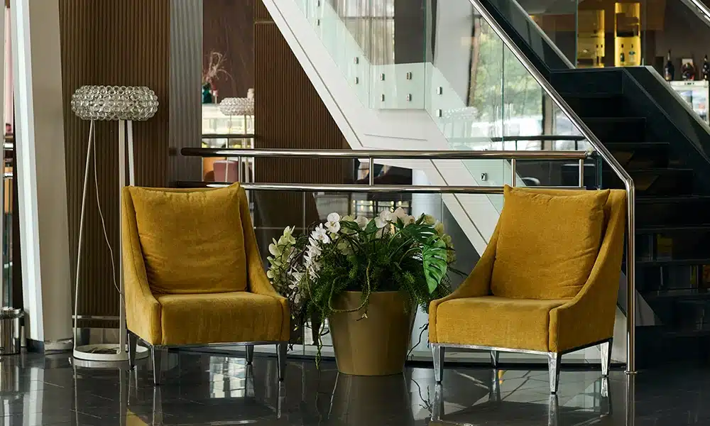 hotel lobby with mustard yellow upholstered chairs
