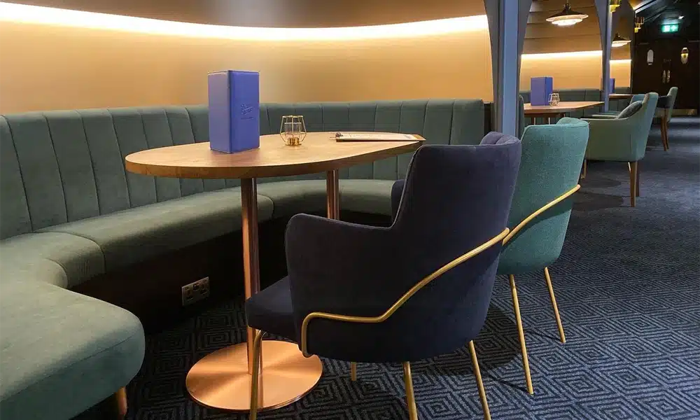 Round booth seating in velvet commercial fabric in a restaurant