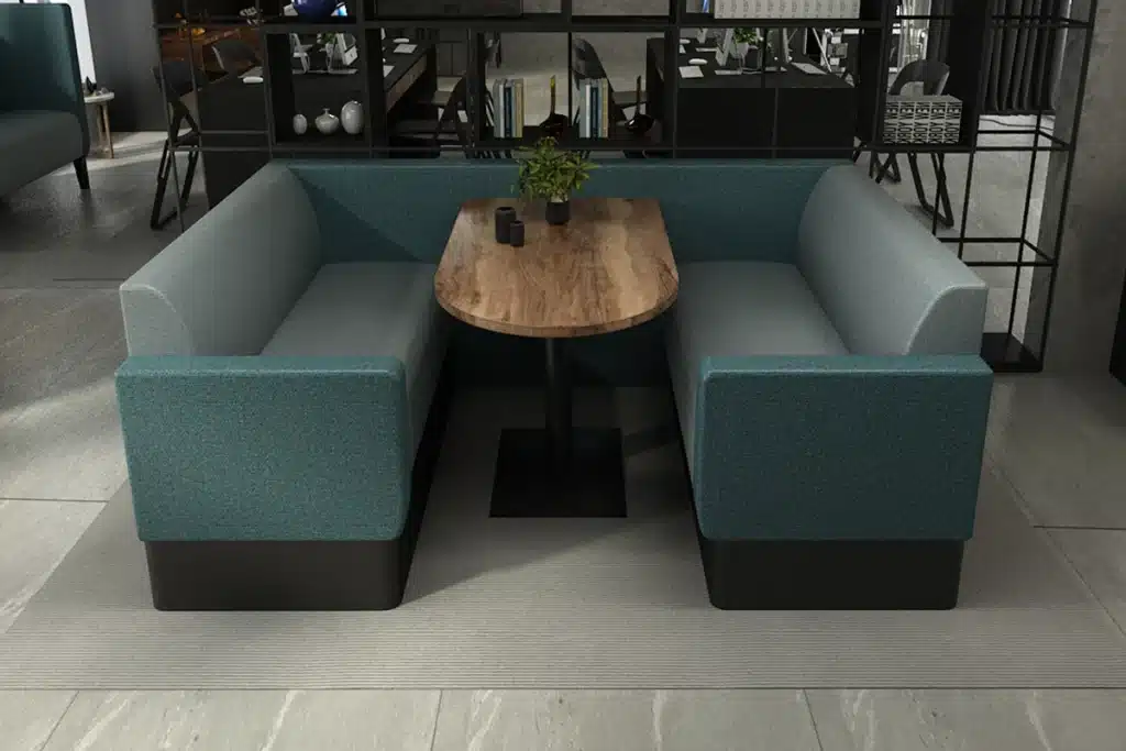 Serene meeting booth set in a modern open-plan office, with standard back seating creating a semi-private workspace.
