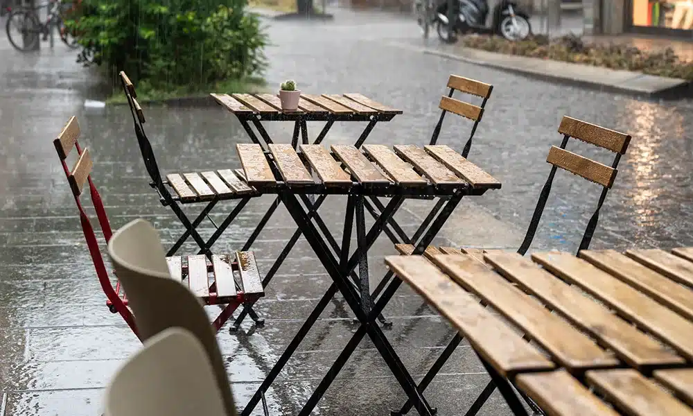 Wooden and Metal chairs outdoors on a rainy day in the UK - Commercial Trade Furniture