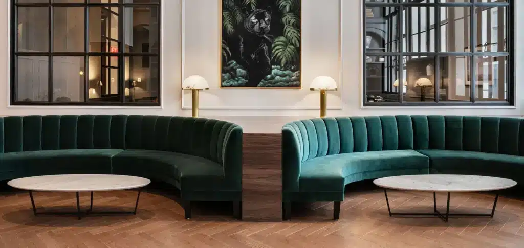 Deep fluted half round booth sets in a plush aqua velvet upholstery, in a luxury wood modern design lounge
