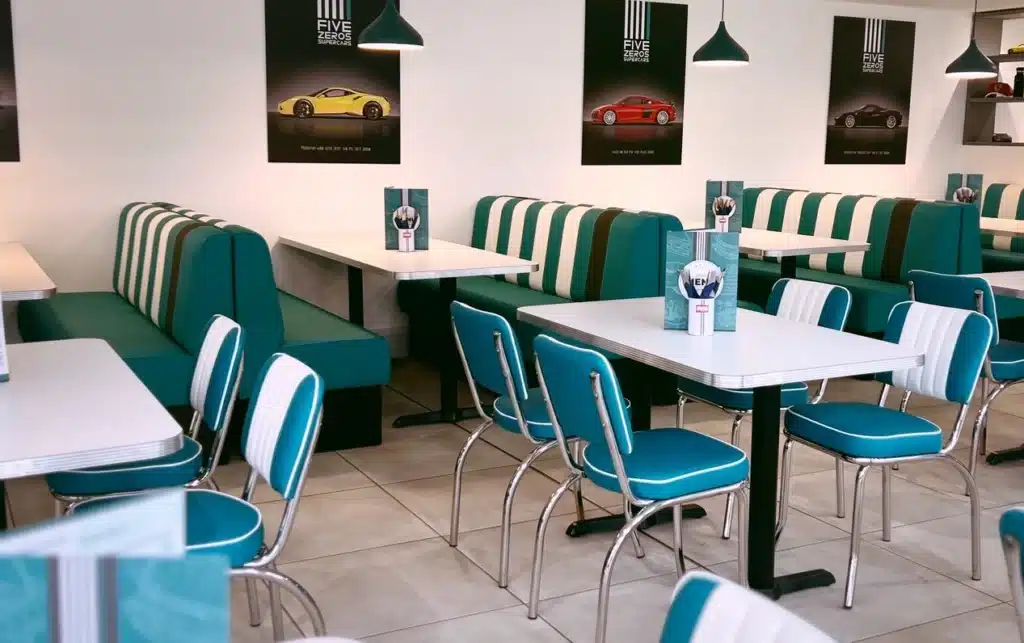Retro diner style cafe with stitch fluted booth seating in a blue and white design