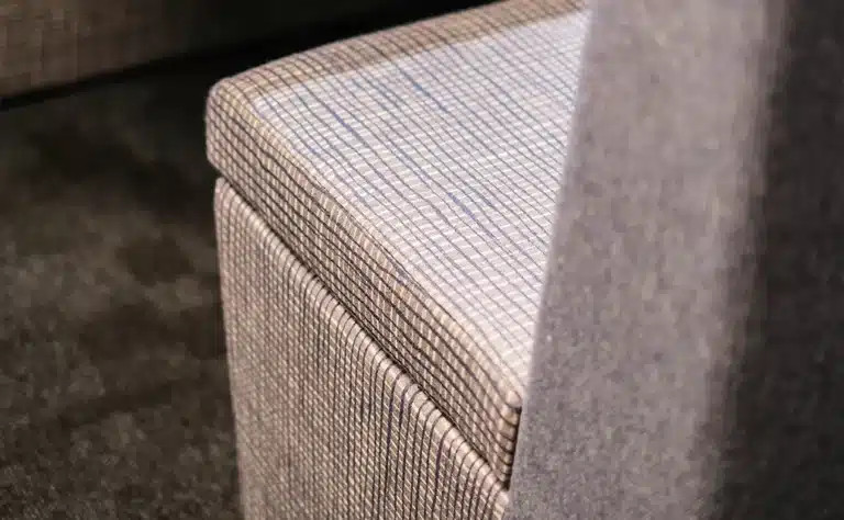 close up of a office meeting pod upholstery, showing the detail of fabric texture on the seat