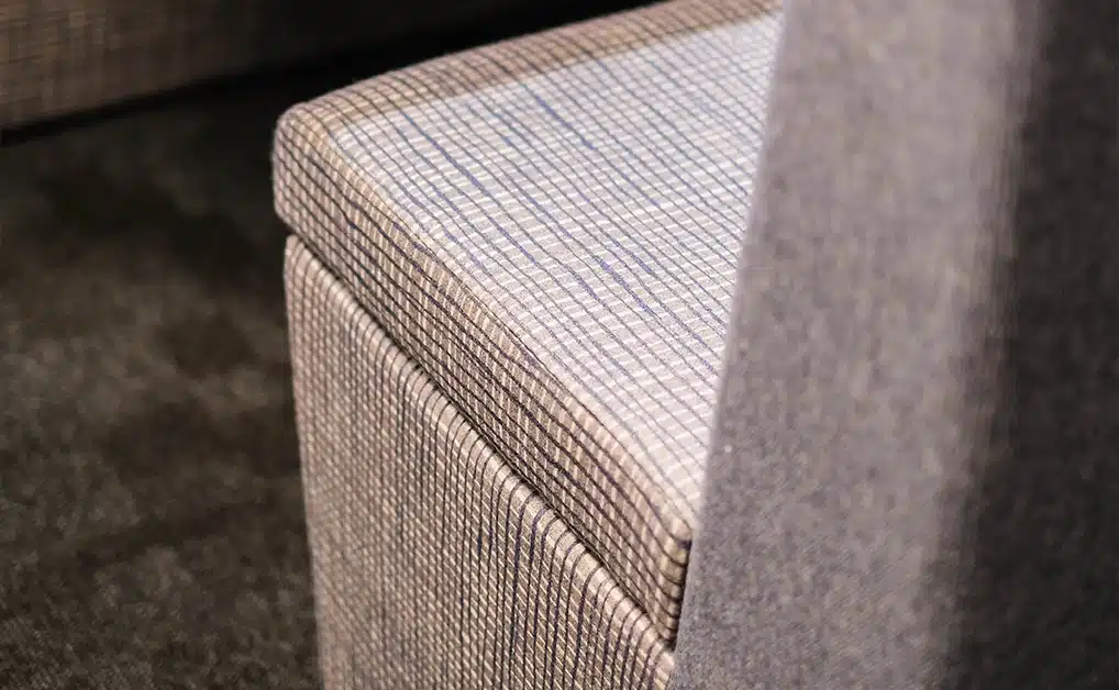 close up of a office meeting pod upholstery, showing the detail of fabric texture on the seat