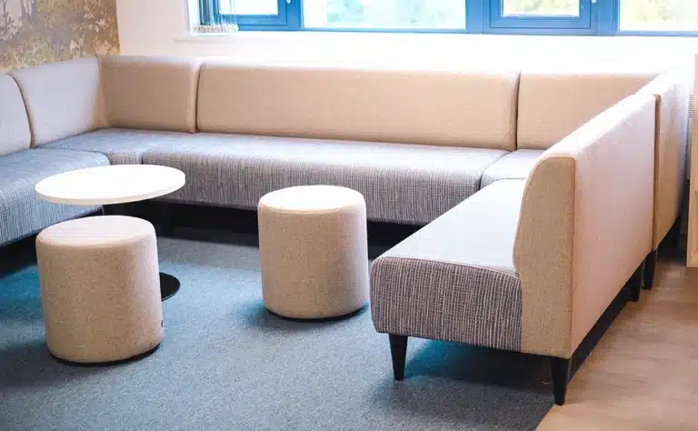 banquette seating in an office breakout staff area, showing commercial furniture built for office spaces