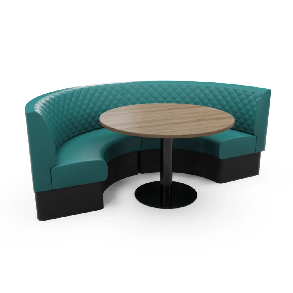 Teal curved booth with diamond-tufted back surrounding a round wood table on a black pedestal base.