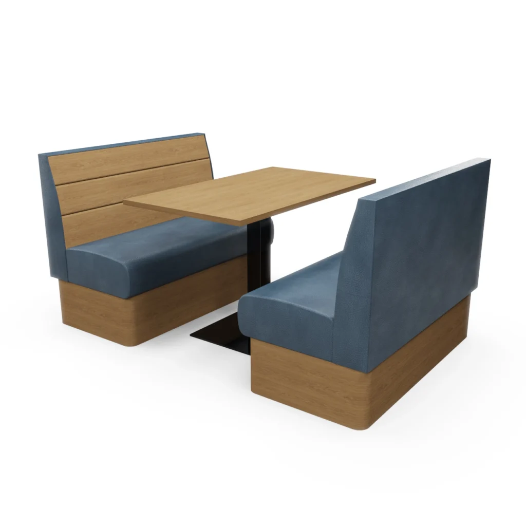 Booth seating with a wooden table between two blue upholstered benches in a modern dining area.