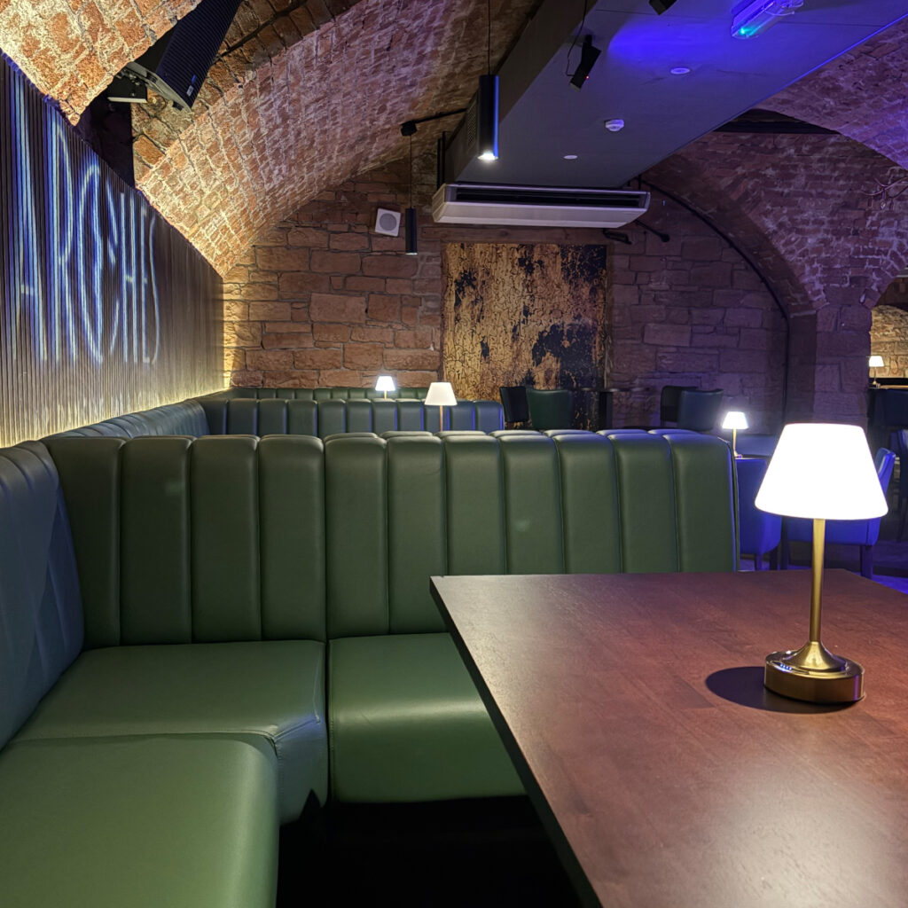Bespoke U-shaped booth seating manufactured for Arch Bar Scotland
